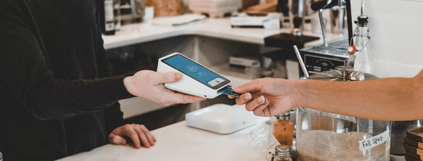 Pangea IoT news: Person buying from mobile ePOS in the carribean